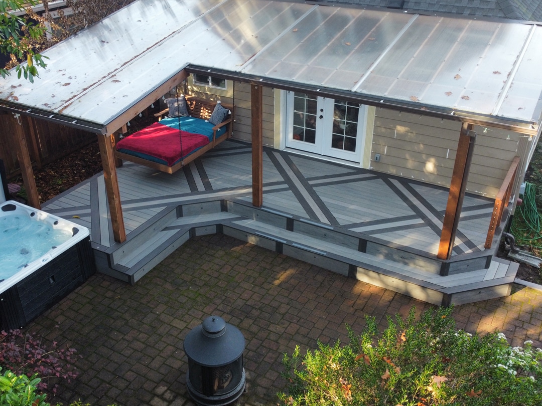 Multi-level deck with pergola and deck inlays, pattern, and steps