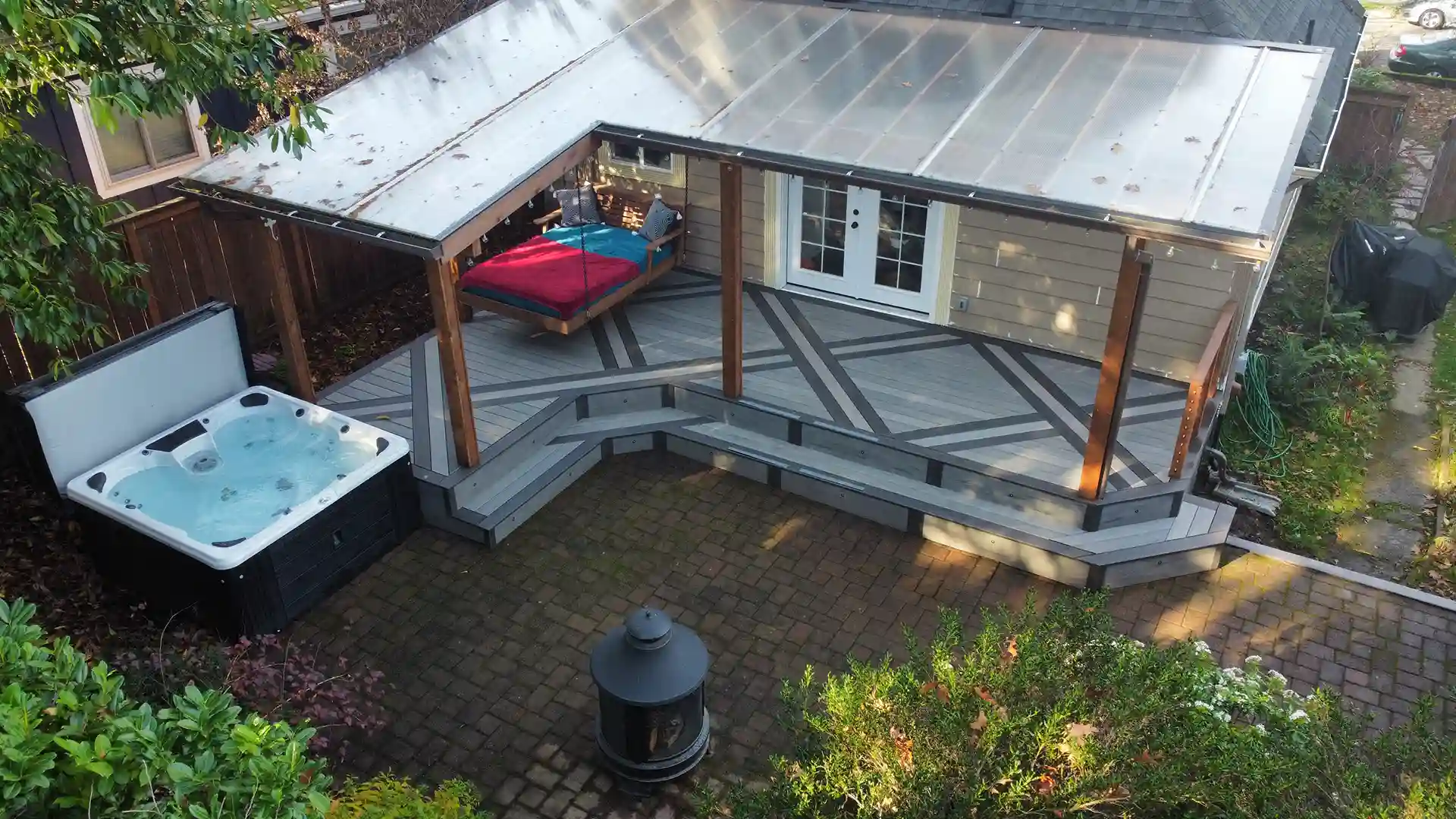 PHoto of a composite deck with deck inlays and a deck cover. 
