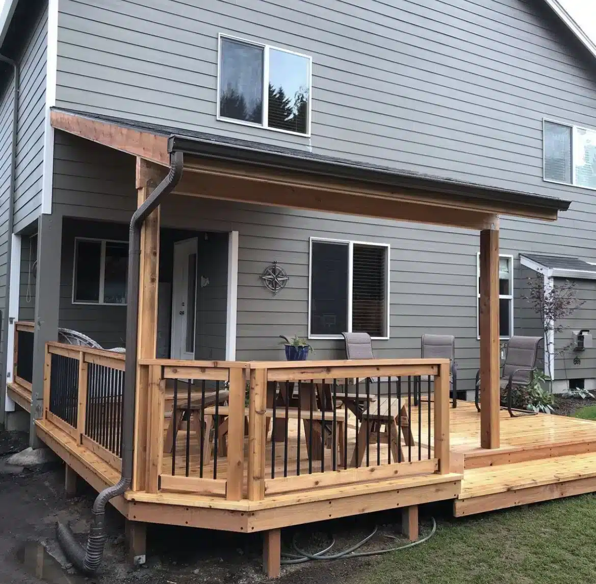 wooden deck with railing and cover - Wood deck contractors