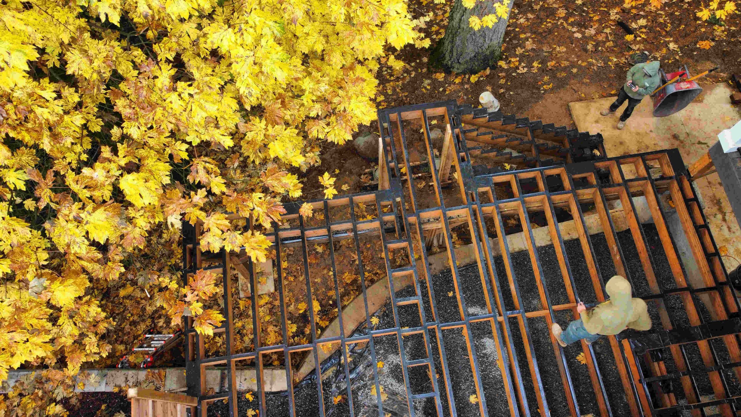 photo of a crew building the frame for a new deck - Reasons to build a deck in winter