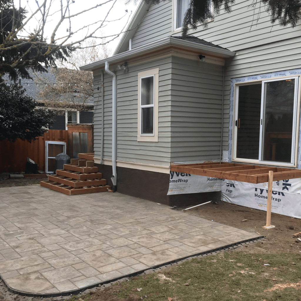 3 paver patio and custom deck under construction