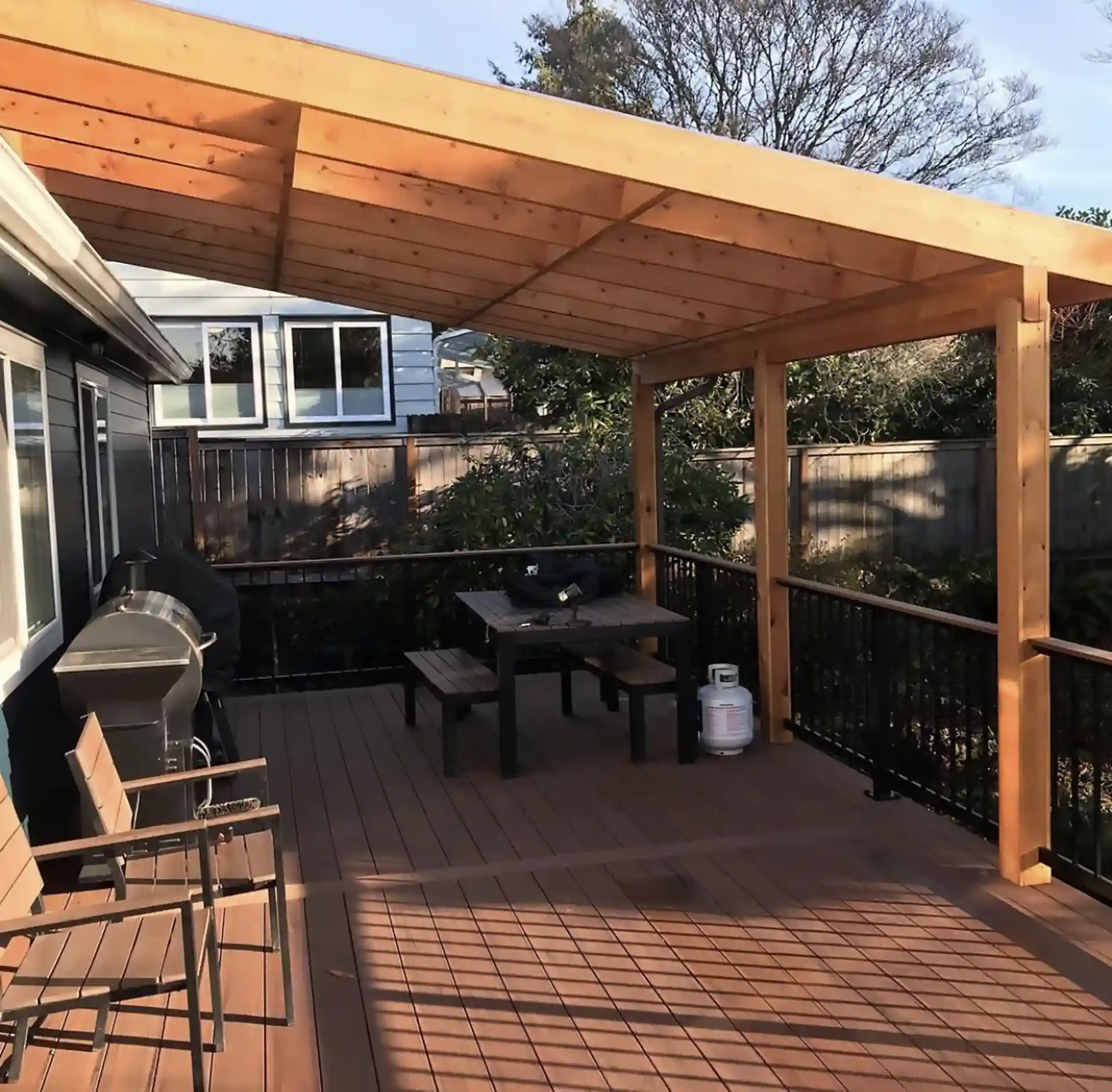 Covered deck with outdoor kitchen and grilling station in Oregon