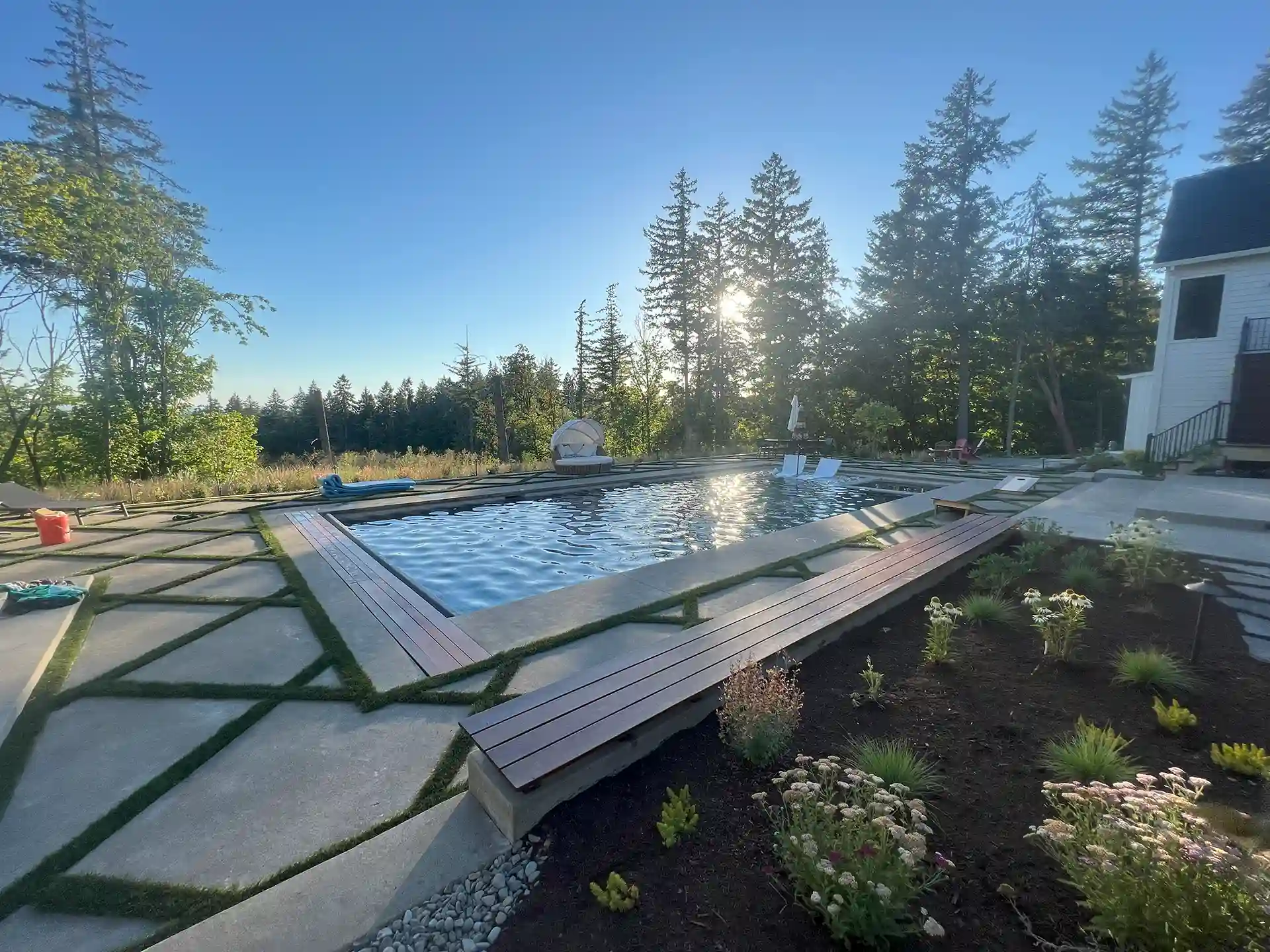 photo of a pool deck with built-in seating